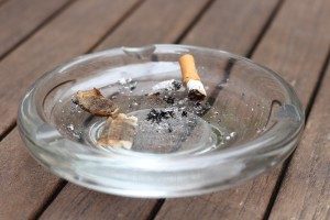 Ash tray placed on a wooden table